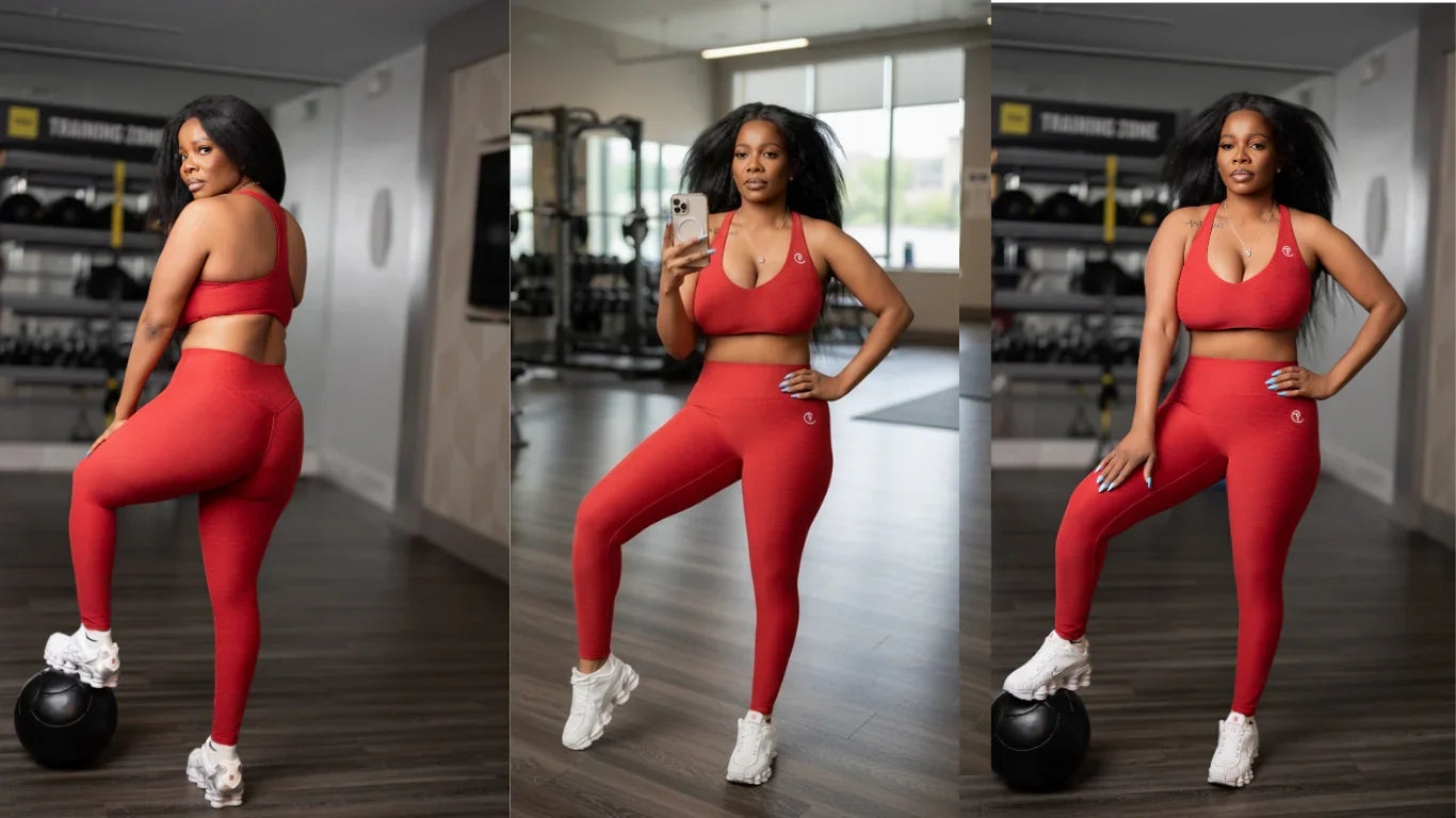 Woman modeling red sports bra and high-waisted leggings set in gym environment.