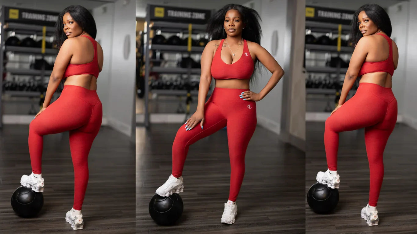 Woman modeling red seamless athletic leggings and sports bra in gym, fitness fashion outfit