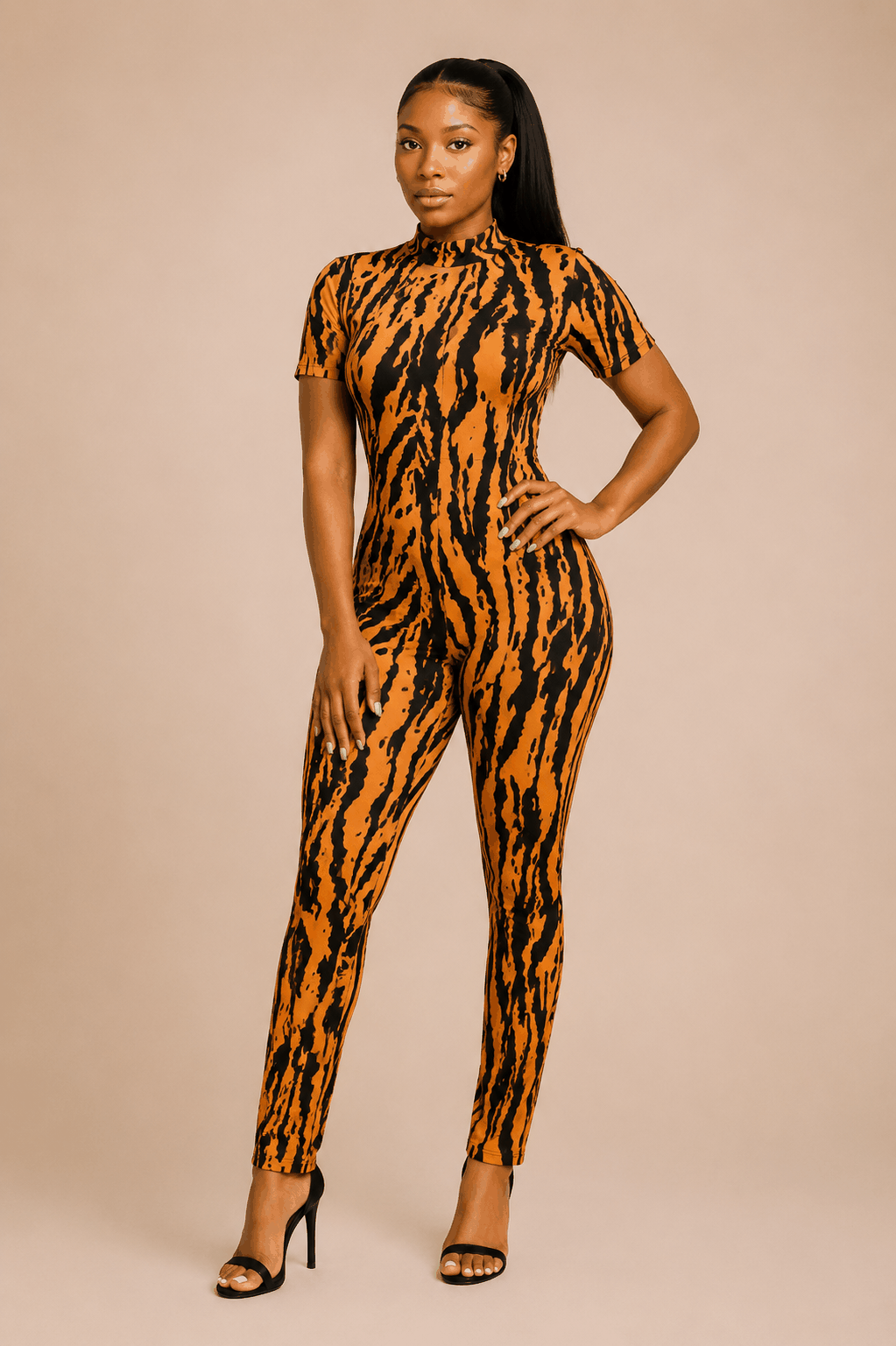 Woman wearing a tiger print bodycon jumpsuit with short sleeves and open-back cutout detail