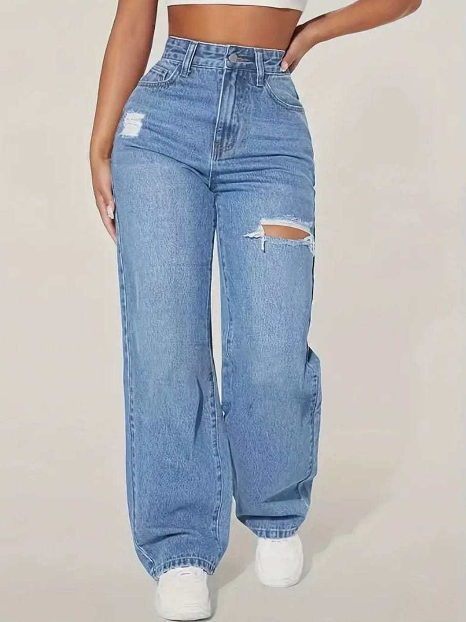 High-waisted ripped blue jeans with wide legs, casual street style