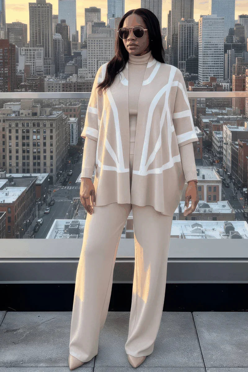Woman in beige knit lounge set with geometric cardigan on urban rooftop at sunset
