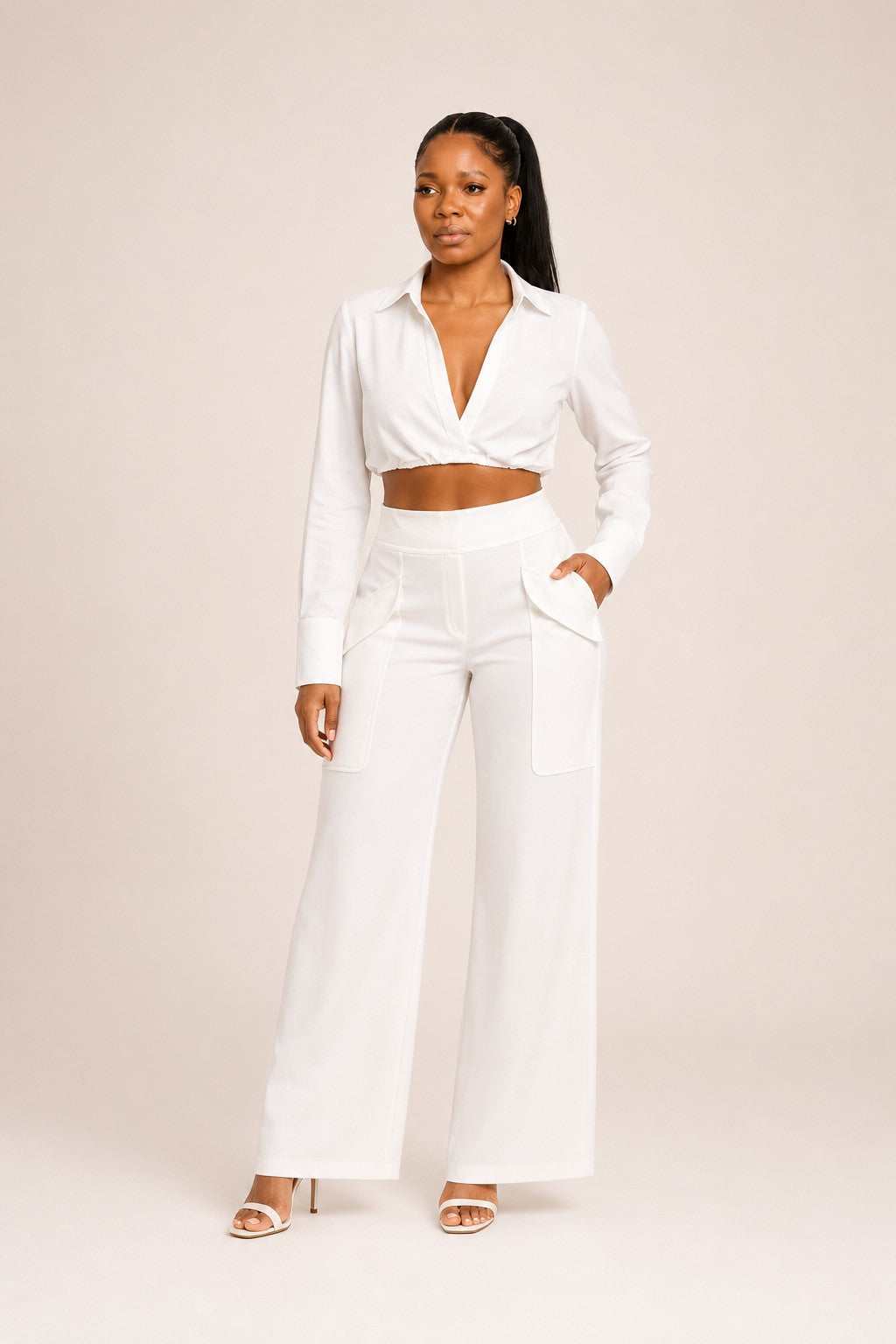 Woman wearing Arctic Poise Set white cropped shirt and high-waisted wide-leg trousers, modern and polished fashion look