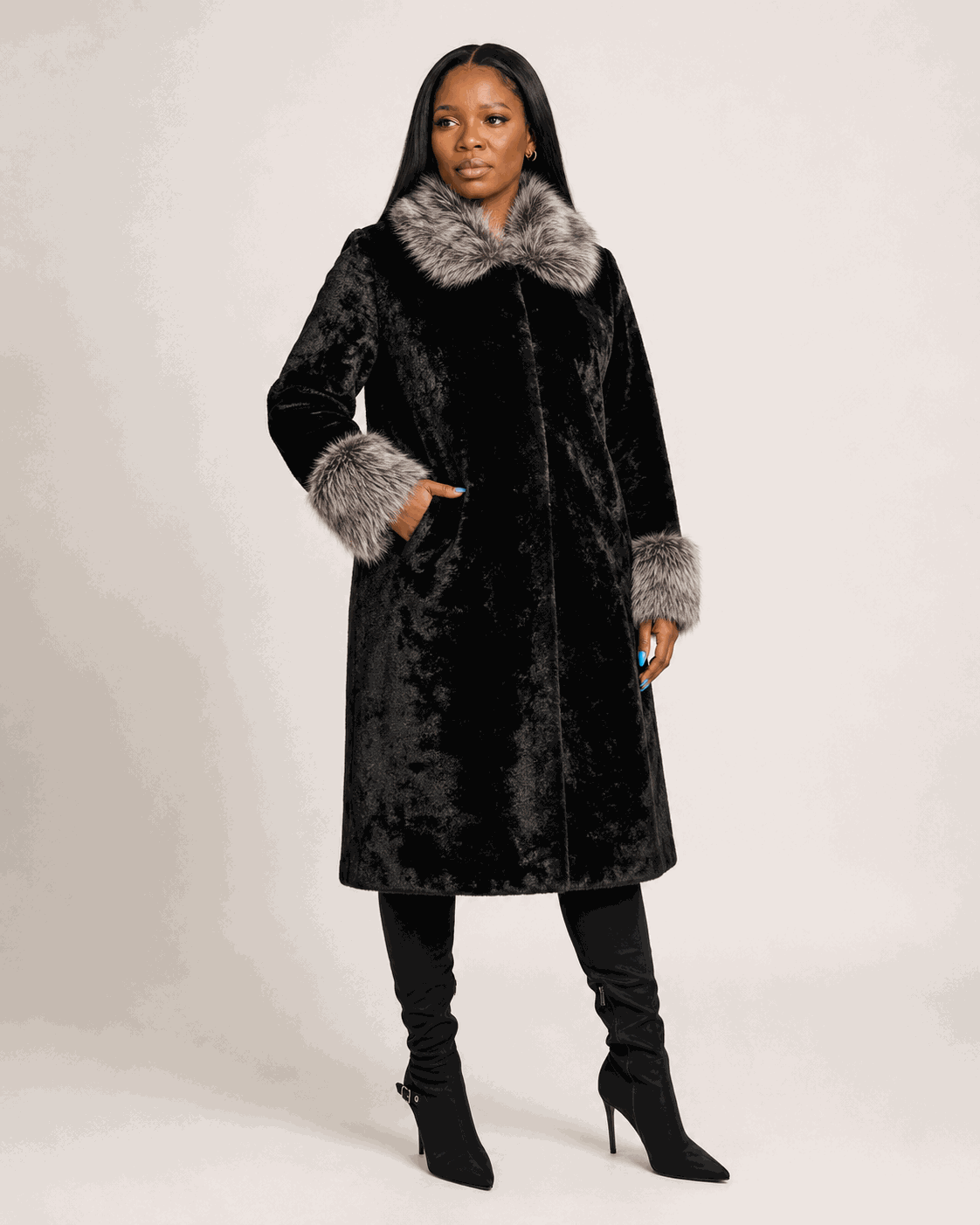 The Ashen Luxe winter coat with soft black and gray fluffy collar and cuffs, featuring a structured silhouette for elegant winter style